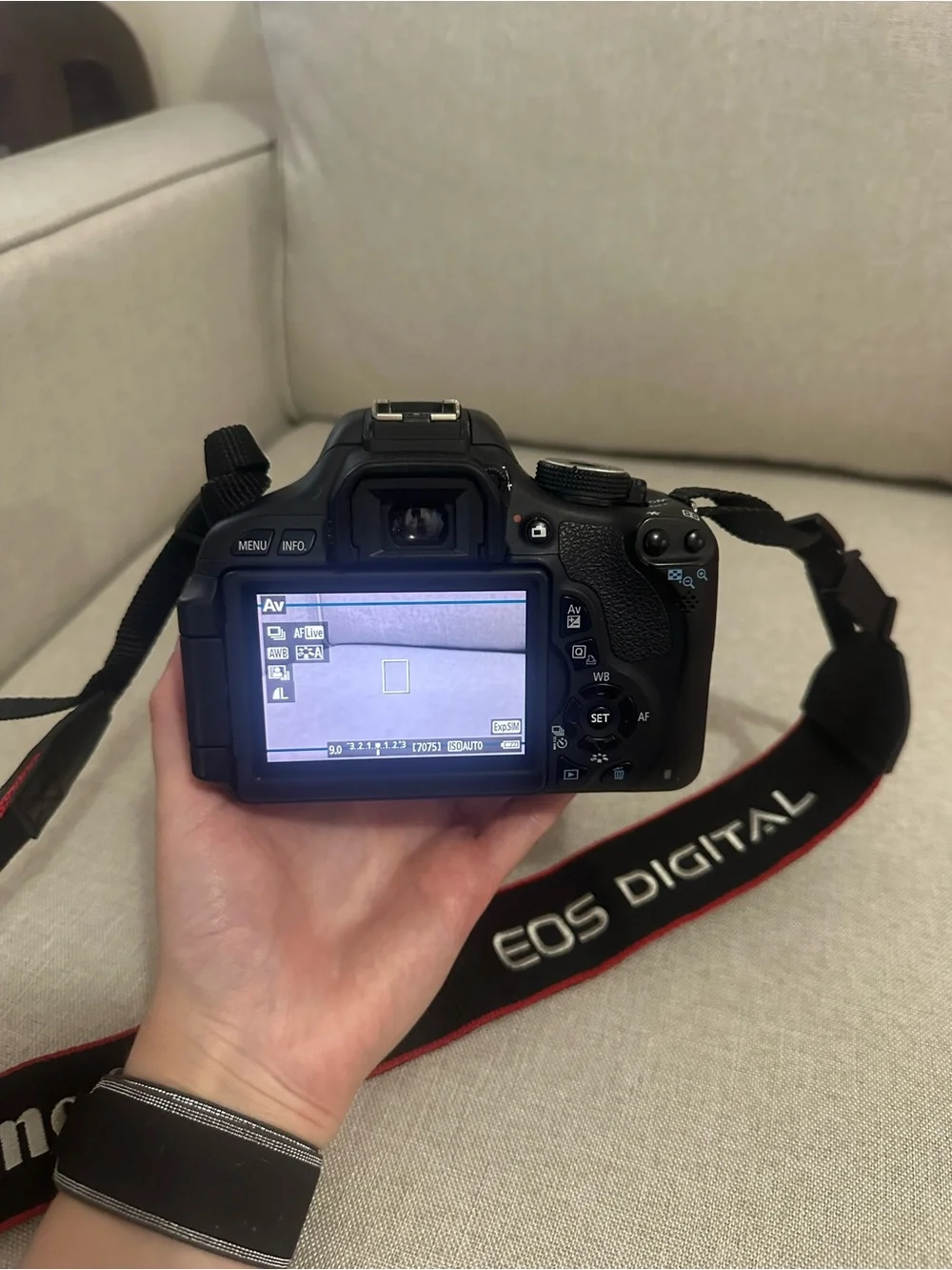 Canon DSLR Camera in Black with Red-Trim Strap